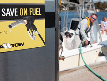 Man refueling his boat with Sea Tow discount
