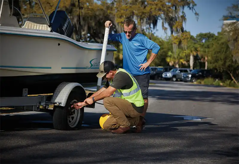 Sea Tow Trailer Care member receiving road side assistance
